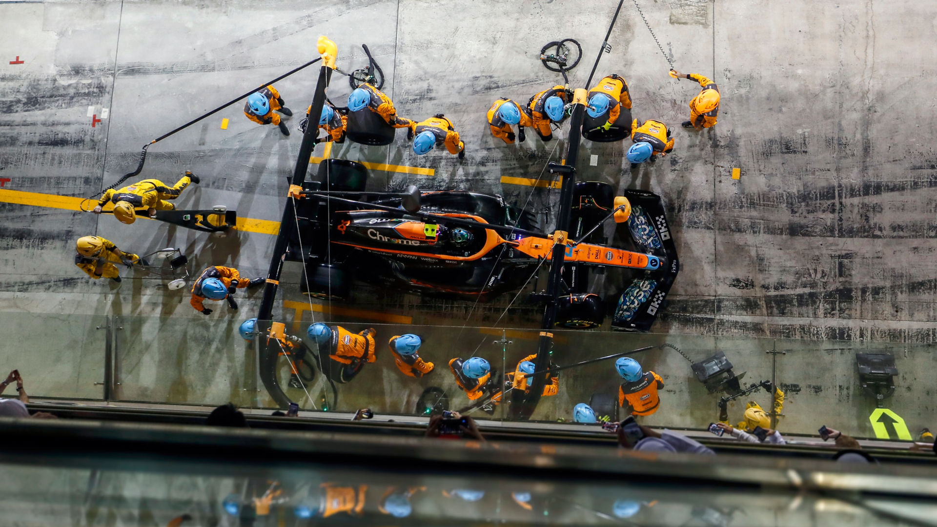 Lando Norris F1 car making a pit stop during a race