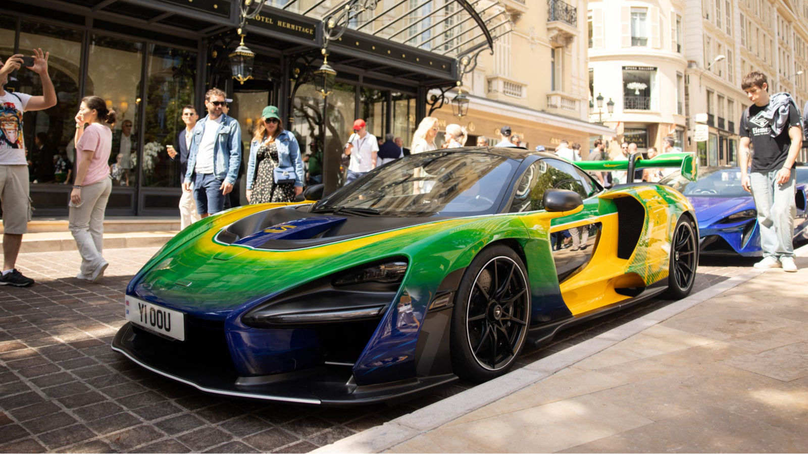 McLaren Senna Sempre parallel parked outside of the Hotel Hermitage entrance.