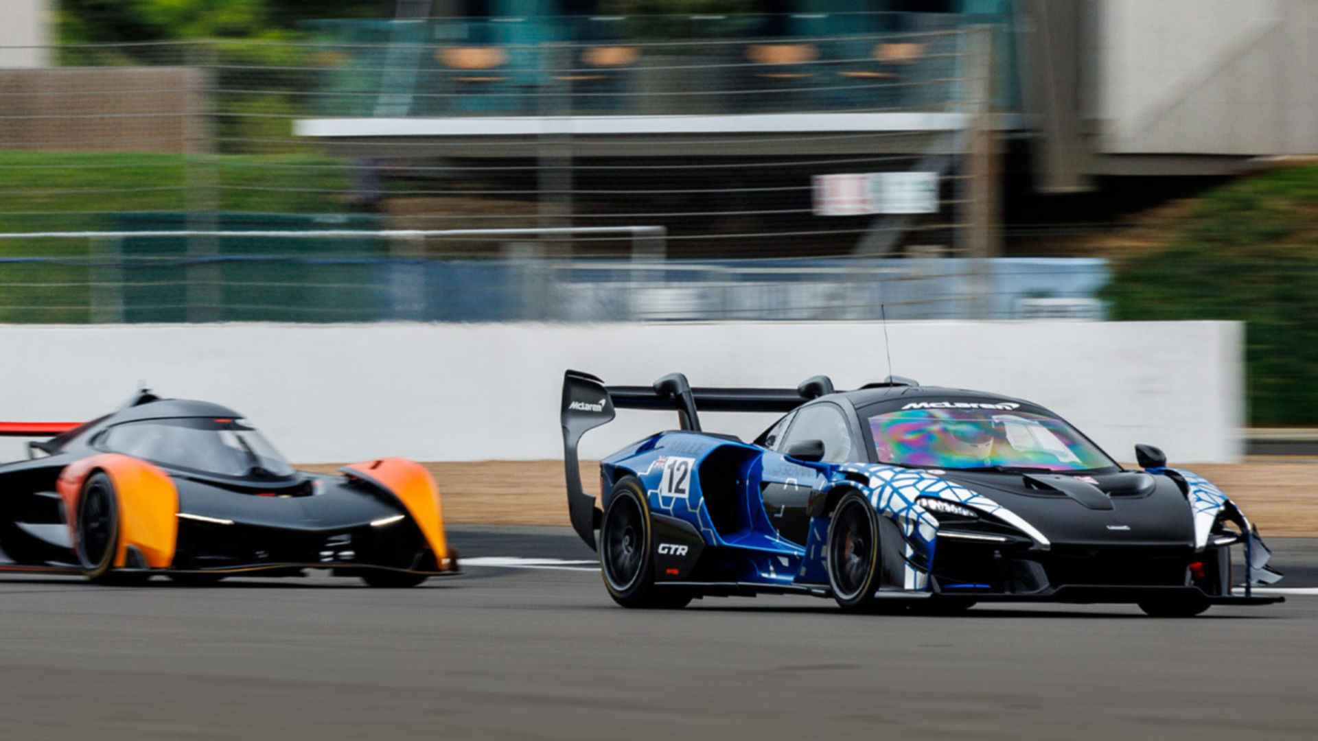 The McLaren Solus GT driving at speed along the Silverstone Track.