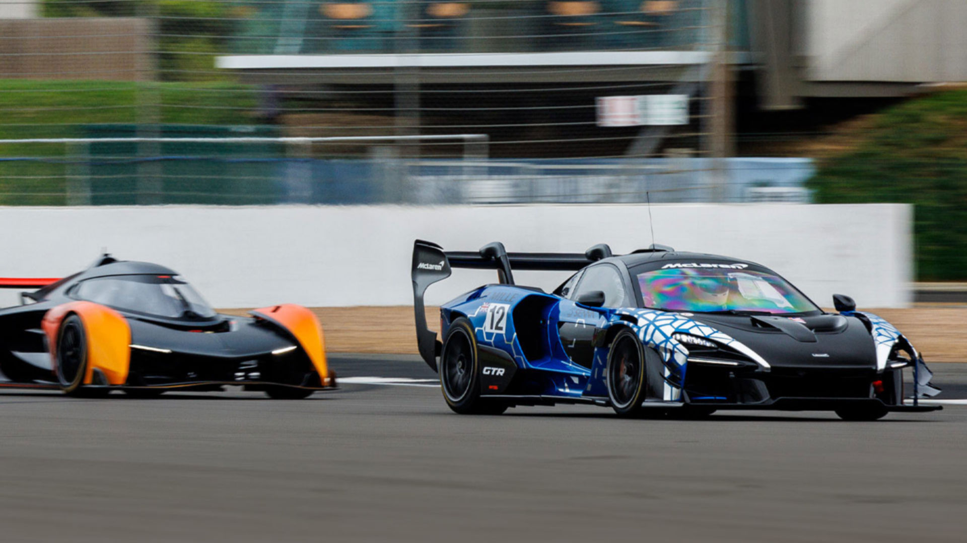 The McLaren Solus GT driving at speed along the Silverstone Track.