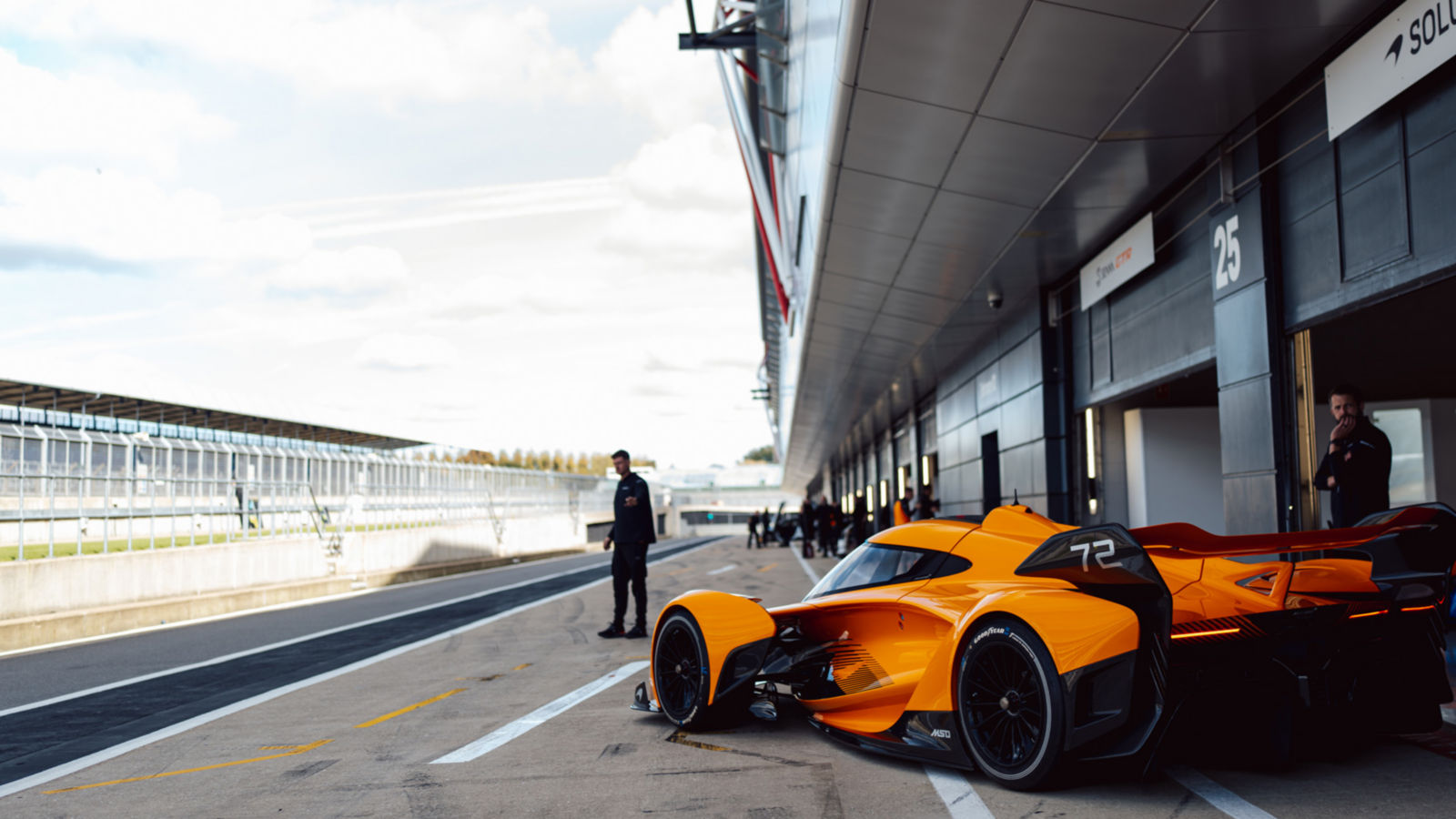 McLaren Supercars aligned on the Silverstone track.