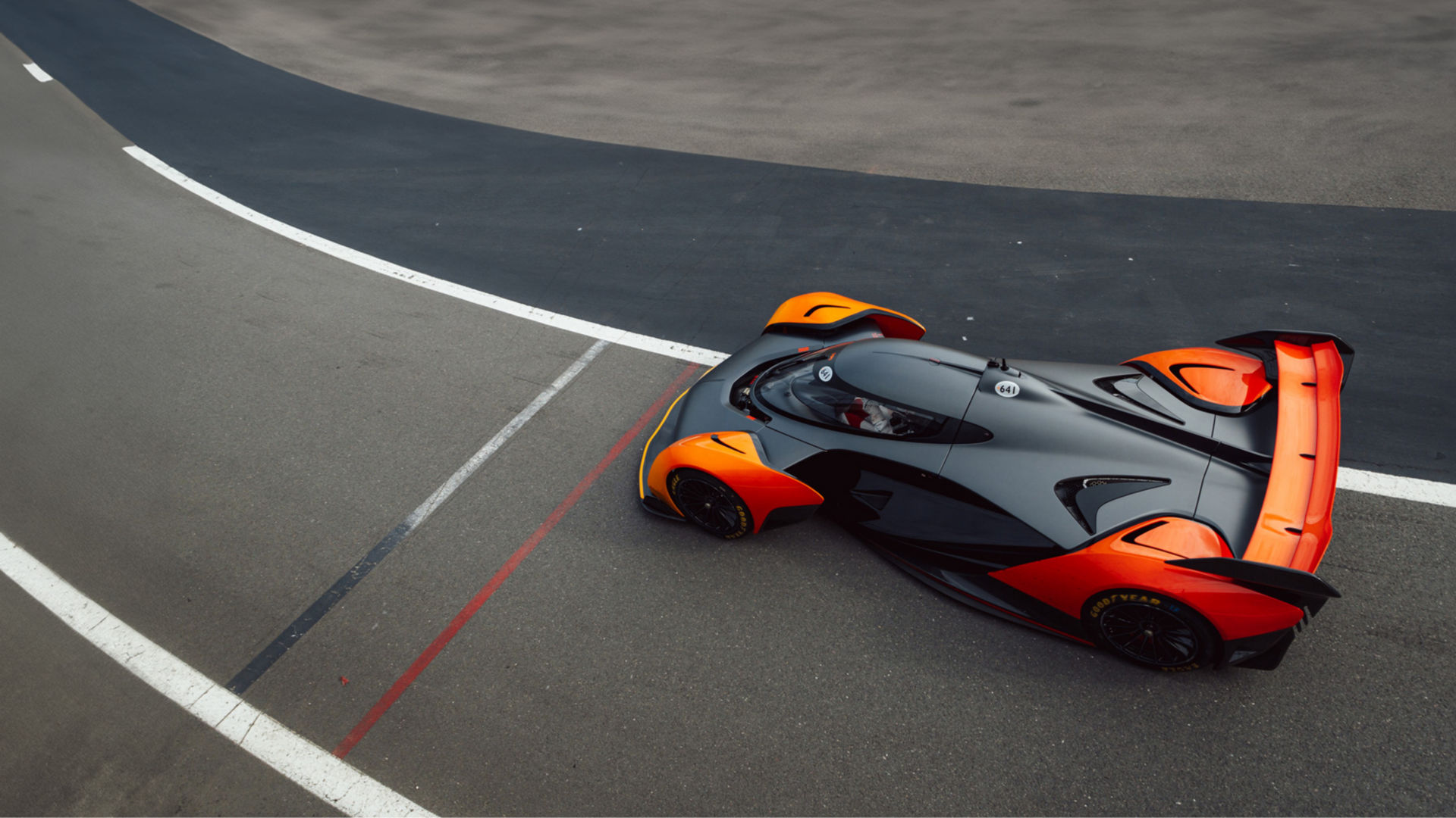 The McLaren Solus GT driving at speed along the Silverstone Track.
