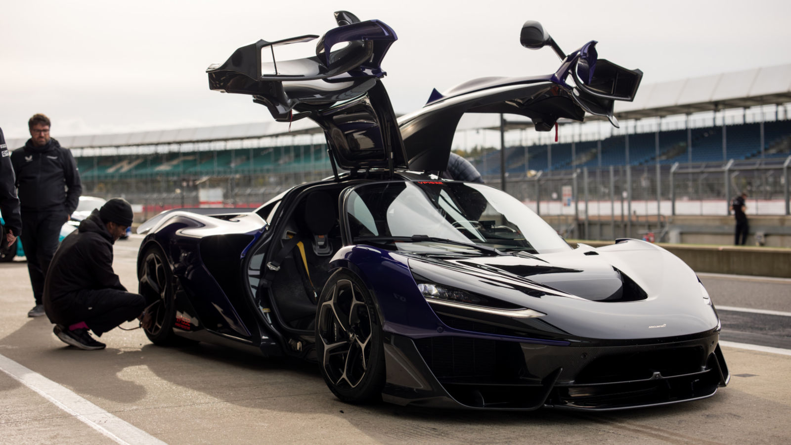 McLaren Supercars aligned on the Silverstone track.