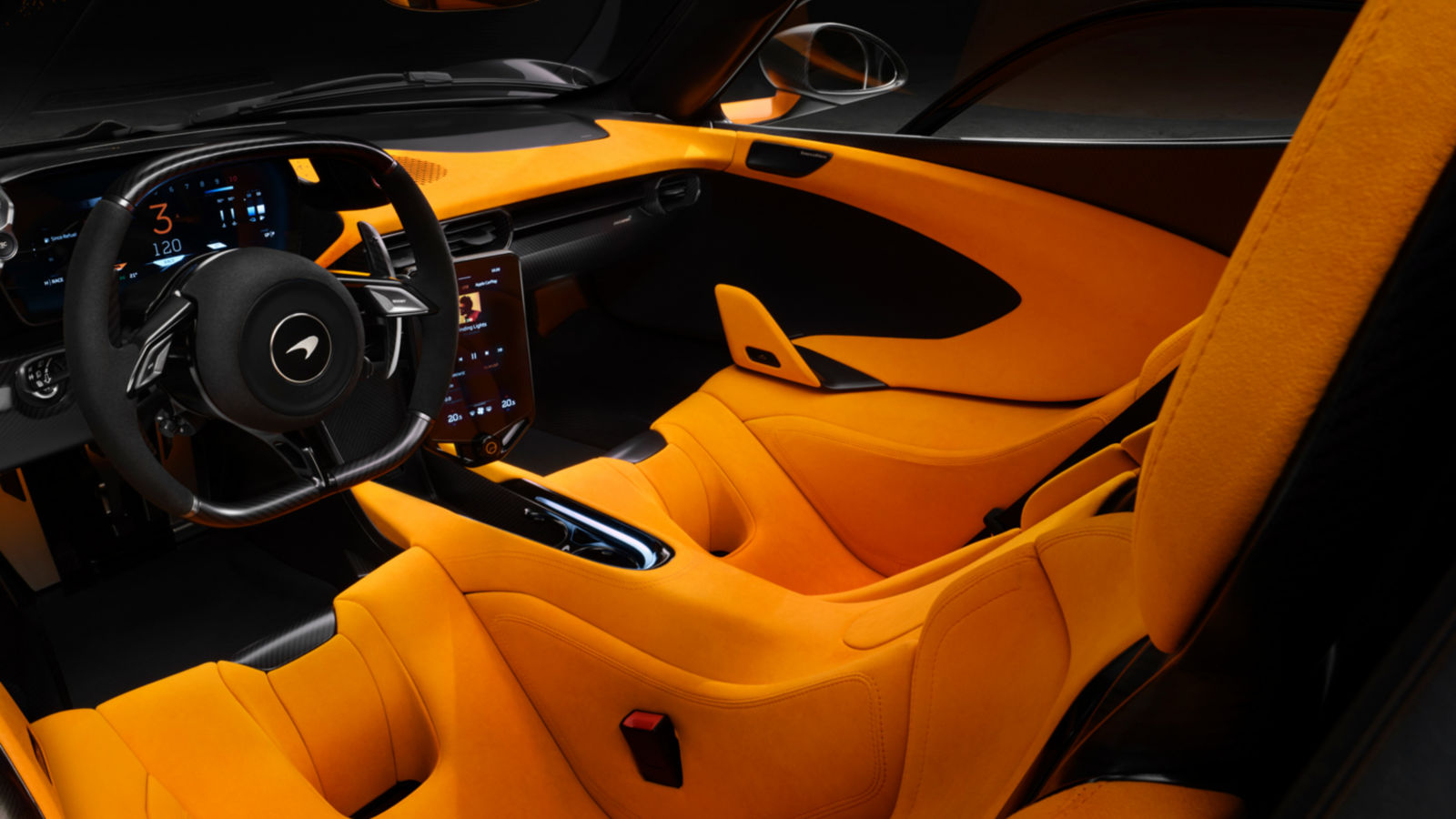 McLaren W1 Papaya coloured front seats and black dashboard detail.